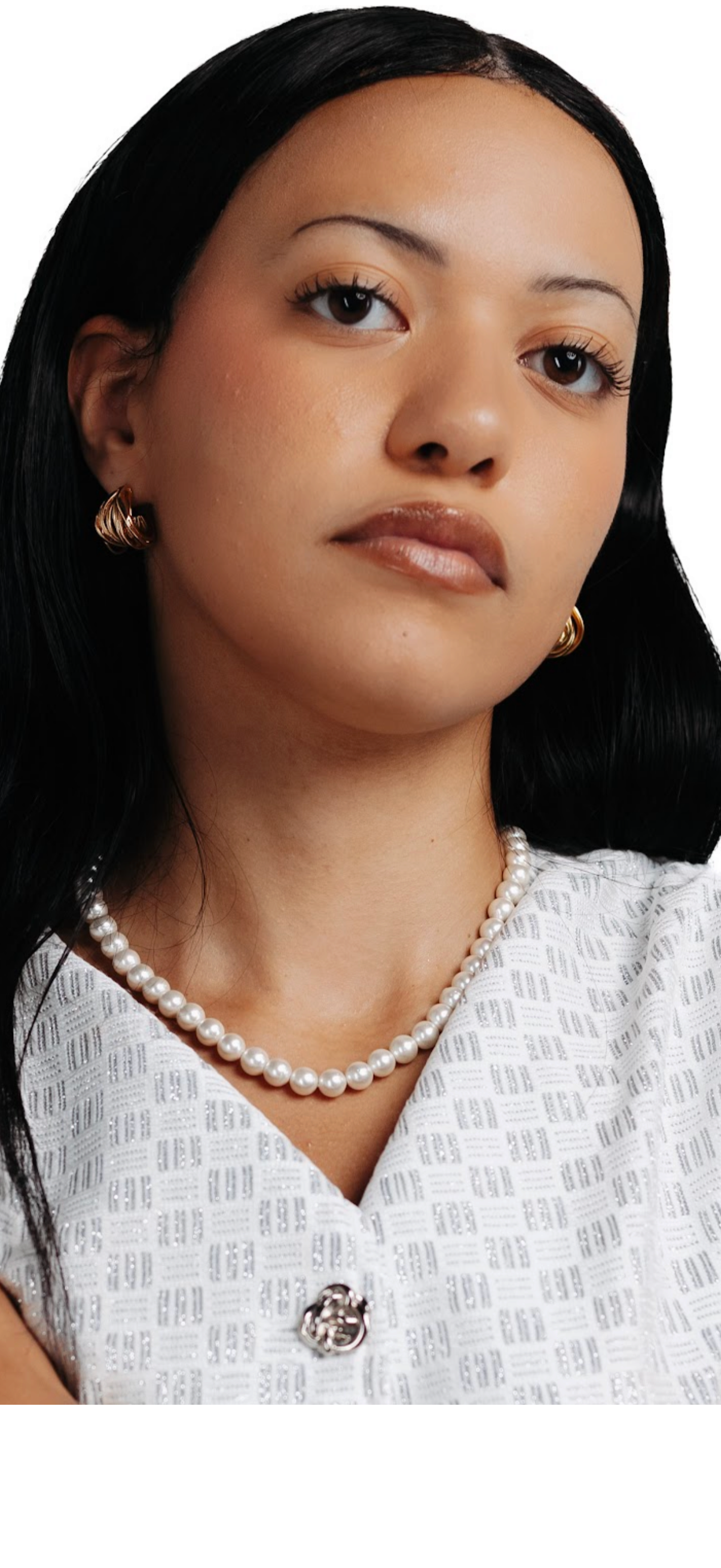 CameroonJewels La Reine Blanche multi-strand genuine freshwater pearl necklace worn by a woman in a white textured top.