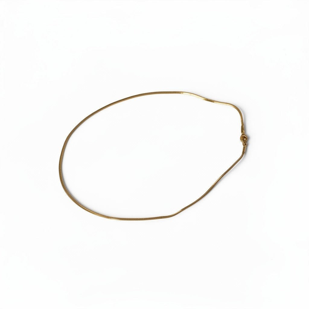 CameroonJewels Fil Doré delicate 18K gold-plated steel chain necklace on a clean white background